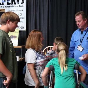 Jeff at an animal show with kids. 