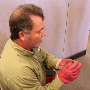 Jeff holding a baby bat. 